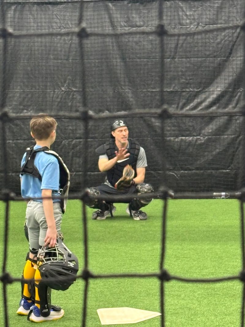 Kevin Rudnicki coaching youth catchers